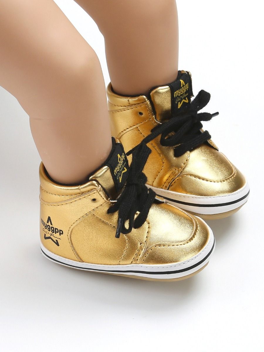 black and gold baby shoes